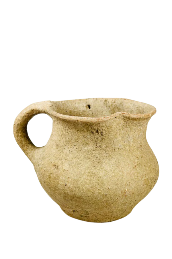 Ancient terracotta jug with single handle and rounded body used as a ceramic vessel