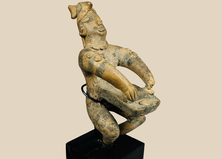 Ancient West Mexican seated terracotta musician figure on display stand