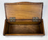Interior view of Anglo-Indian trinket box with unlined wood compartment and brass hinges