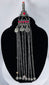 Antique Afghan Kuchi silver-toned tribal pendant with cascading chains, protective prayer tube, and traditional nomadic craftsmanship.
