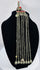 Historic Kuchi pendant ornament from Afghanistan featuring a hirz prayer tube, red cabochons, and bell-shaped dangles.