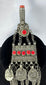 Antique Kuchi tribal ornament with a cylindrical prayer tube, decorative medallions, and long suspended chains.