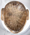 Antique African tribal mask with remnants of pigment and expressive anthropomorphic form