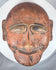 African ethnographic ceremonial mask with weathered surface, carved details, and ritual character