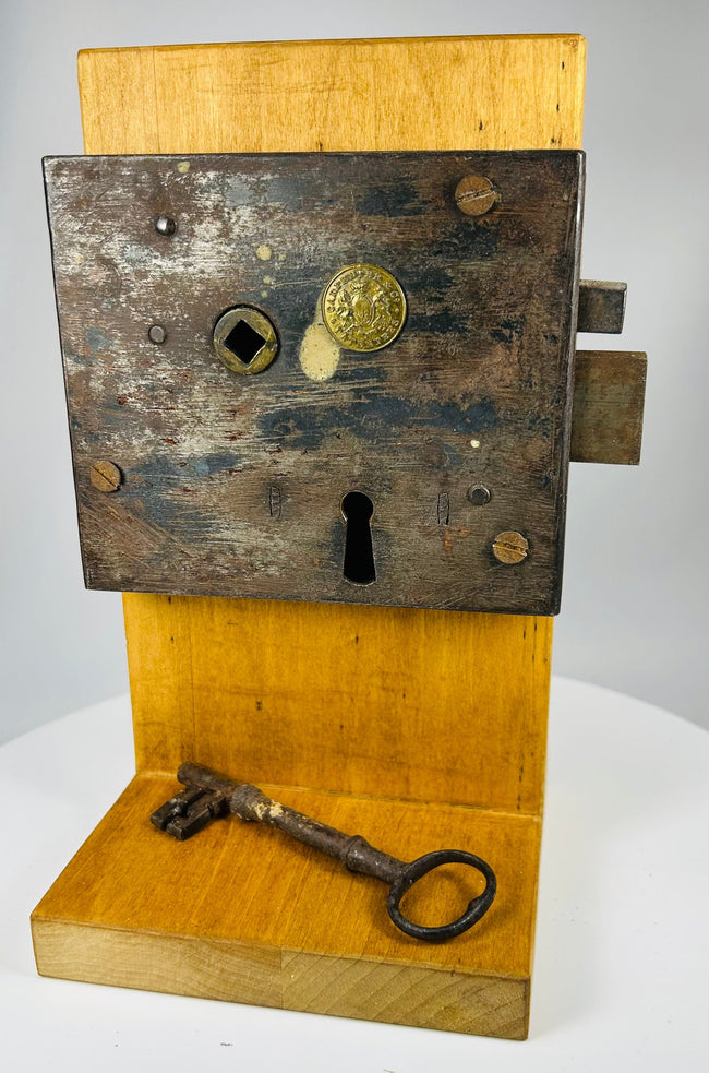 Antique American iron rim lock with visible mechanical components