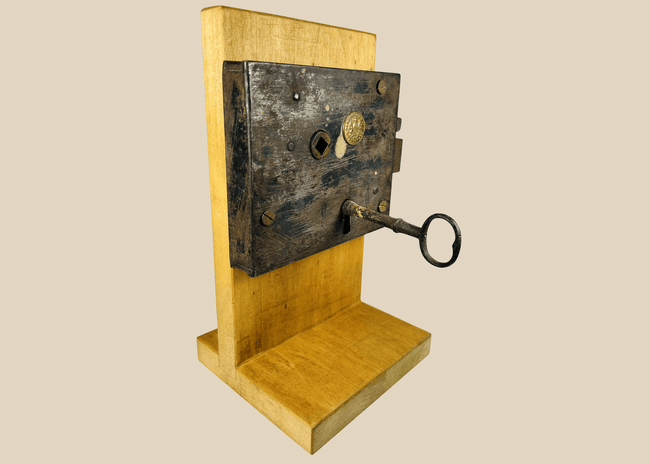 Antique Carpenter and Co rim lock with original iron key and forged metal body