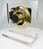 Vintage safe combination lock mechanism showing brass dial and inner workings