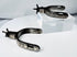 Pair of collectible Western Americana spurs with hand-chiseled silver ornamentation