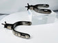 Pair of collectible Western Americana spurs with hand-chiseled silver ornamentation