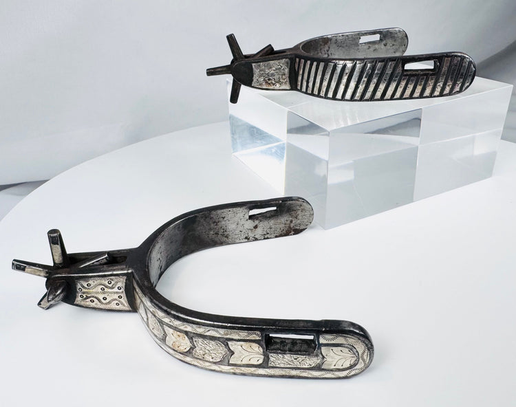 Antique American frontier spurs displaying Southwestern silversmithing influence
