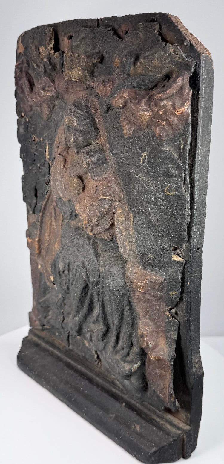 Distressed Baroque wood carving with surviving gilding, darkened surface coatings, chips and devotional wear