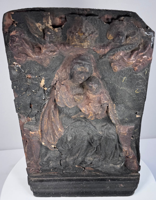 Detail of the Virgin Mary and Christ Child showing worn polychrome surface, exposed wood and surviving historic pigment
