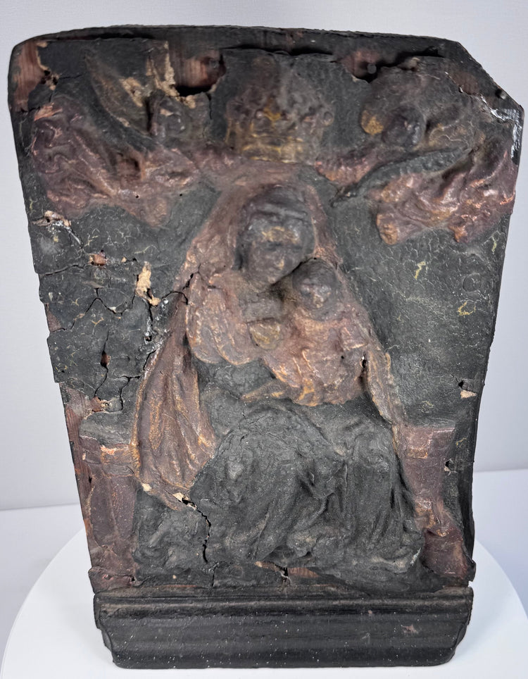 Detail of the Virgin Mary and Christ Child showing worn polychrome surface, exposed wood and surviving historic pigment