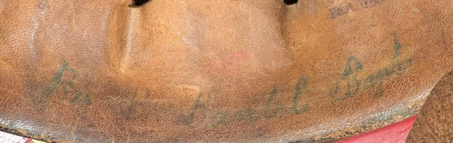Close-up of aged leather liner and faded period markings inside German Feuerwehrhelm, circa 1908–1934