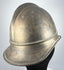 Antique Bavarian firefighter helmet showing broad rear brim and longitudinal brass comb, circa 1908–1934