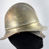 Antique German Feuerwehrhelm showing curved rear neck guard and brass construction, circa 1908–1934