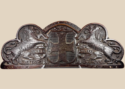 Antique Bentinck family heraldic oak pediment with cross moline, paired lions, and Craignez Honte motto