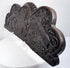 Close-up of the weathered oak surface, carved lion, heraldic shield, and naturally developed wear