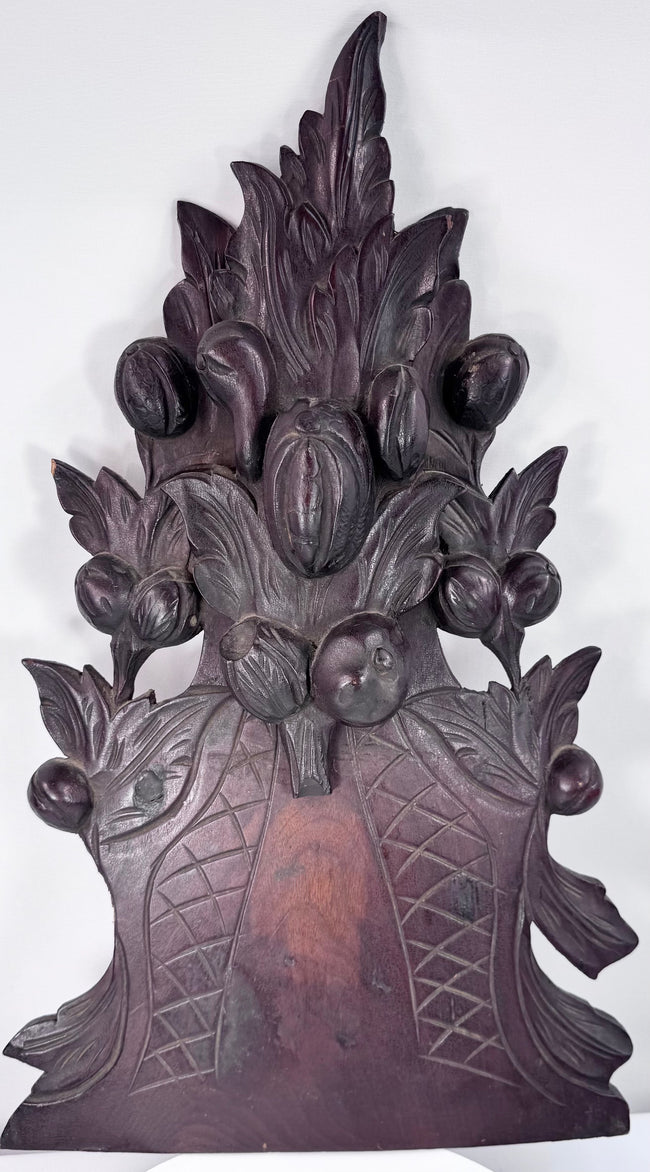 Reverse of 19th-century carved furniture crest showing mounting holes, screws, old attachment points and original construction evidence