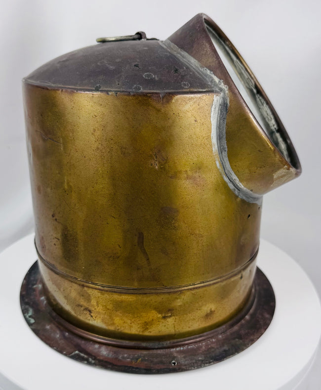 Brass maritime binnacle compass with visible compass card and aged nautical character
