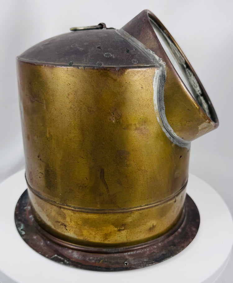 Brass maritime binnacle compass with visible compass card and aged nautical character
