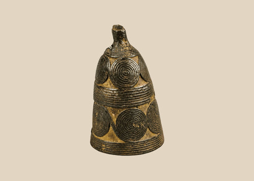 Antique Tibetan Buddhist ritual bell with spiral coil motifs and dark patina