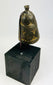 Antique Himalayan ghanta bell showing dark ritual patina and detailed vajra handle.