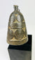 Tibetan ritual ghanta bell displaying detailed casting and traditional Buddhist symbolism.