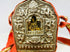 Tibetan portable Gau amulet box featuring seated Buddha and auspicious motifs, silvered copper alloy