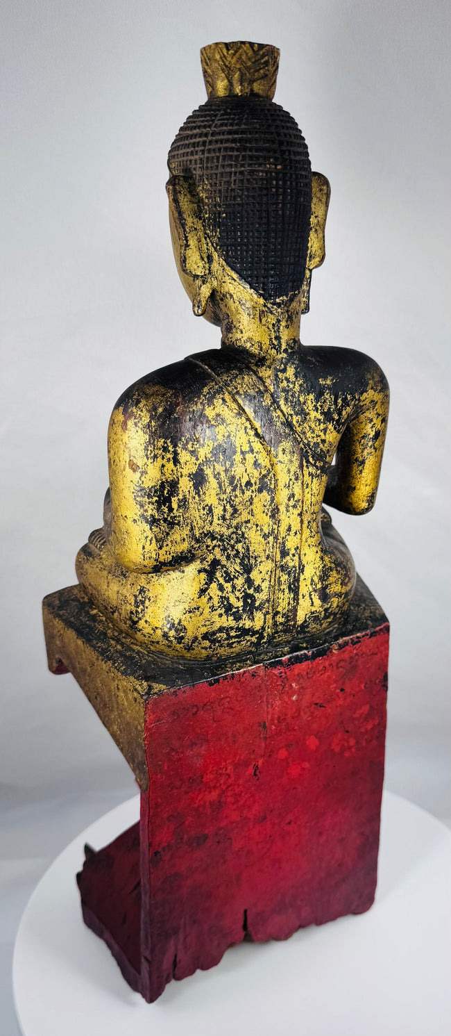 Antique Shan Buddha statue exhibiting devotional wear and historic gilded finish.