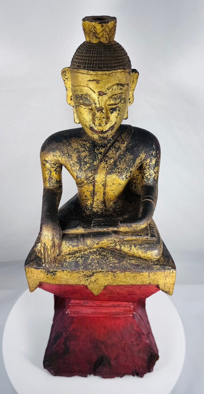 Shan Buddhist devotional figure featuring elongated facial features and prominent ushnisha finial.