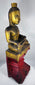 Historic Burmese Buddha image with surviving gold leaf decoration and red lacquer base.