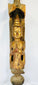 Museum-style display of an antique Burmese Buddhist temple finial with gilded figure