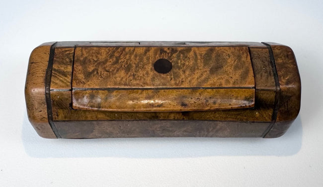 Early Victorian burr walnut pocket snuff box with canted corners, dark stringing, and warm golden-brown patina.