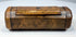 19th-century burr walnut tobacco snuff box with hinged cover, rounded terminal sections, and natural wood figuring.