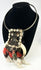 Papua New Guinea ceremonial dance necklace mounted on display stand