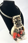 Papua New Guinea ceremonial dance necklace mounted on display stand
