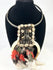 Ceremonial Papua New Guinea tribal necklace with shell, bone, and red feathers