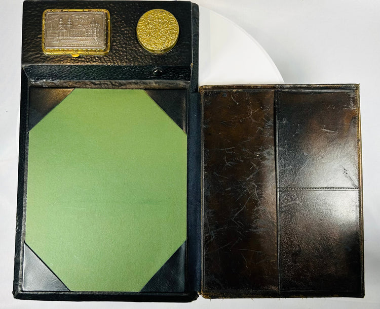 Leather-covered writing slope with brass fittings and inkwell section
