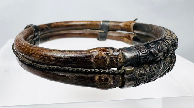 Qing-era bamboo bracelet with raised floral panels and dark aged patina