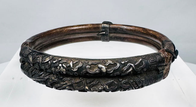 Nineteenth-century bamboo bangle with scrolling blossoms, leaves, and metal collars