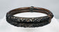 Nineteenth-century bamboo bangle with scrolling blossoms, leaves, and metal collars