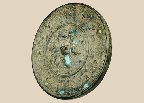 Antique Chinese bronze mirror with sea creature motifs in Tang Dynasty style