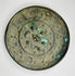 Chinese antique bronze mirror with ornate relief decoration on reverse