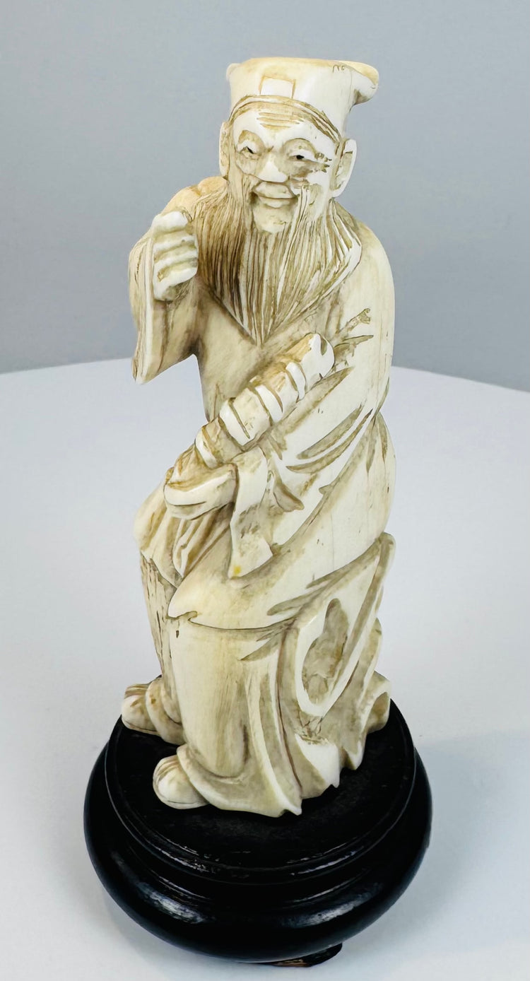 Front view of a late Qing Zhang Guolao figure holding a bamboo yugu drum
