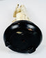 Underside view of the ebonized wooden base supporting the Zhang Guolao figure