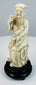 Chinese Eight Immortals carving of Zhang Guolao on an ebonized wood base