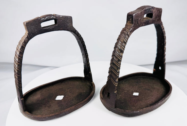 Pair of traditional Chinese riding stirrups with chiseled decorative details