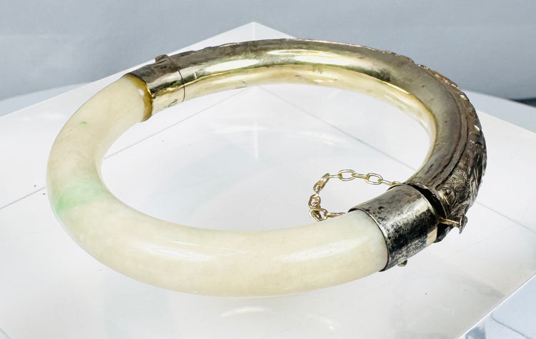 Vintage hinged bracelet with natural green stone inclusions and marked silver fittings