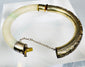 Antique pale green hardstone bangle mounted in chased silver fittings